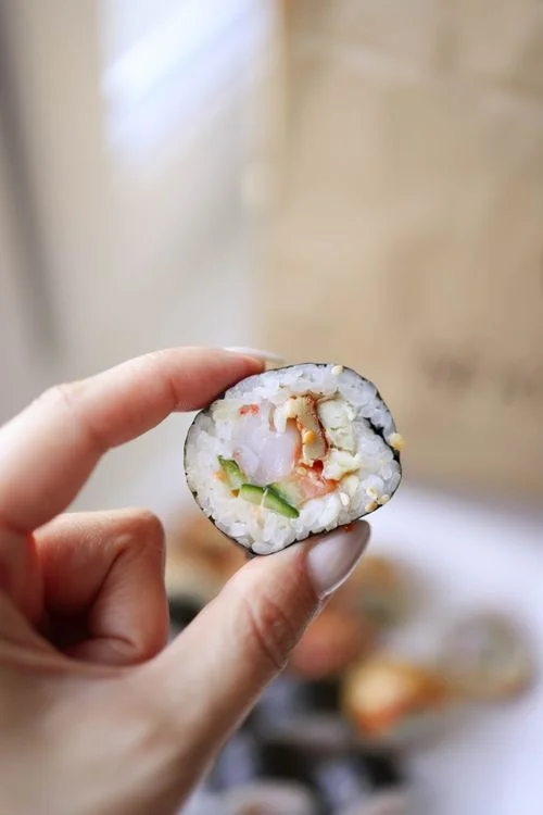 modern sushi roll hand held